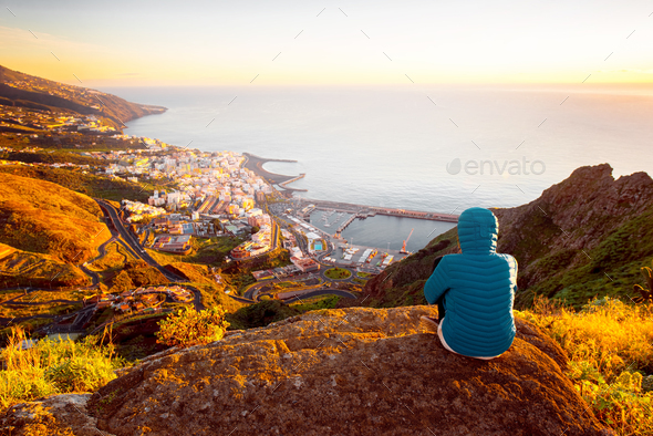 Woman enjoying landscape view near Santa Cruz city Stock Photo by